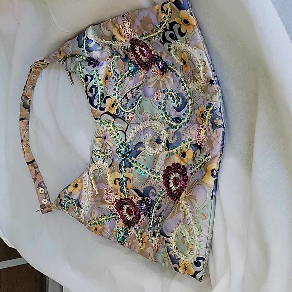 Purse with beading on front.